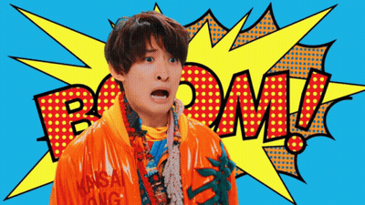 Man In Orange Jacket With Boom Speech Bubble GIF