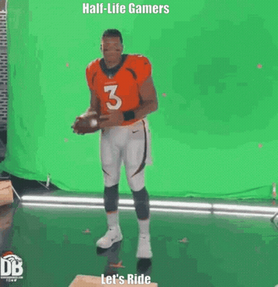 Man In Orange Jersey Holding Football GIF