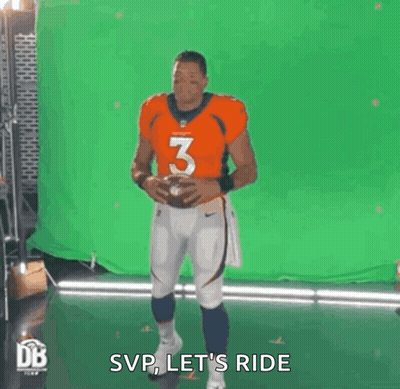 Man In Orange Jersey Holding Football GIF