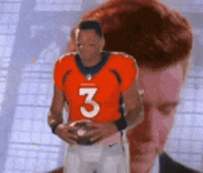 Man In Orange Jersey Number 3 Holding Football GIF