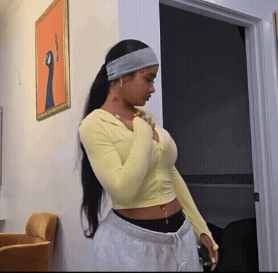 Man In Orange Jumpsuit And King Of The Hill Hat GIF