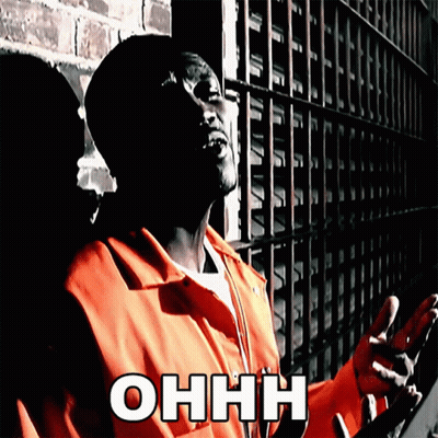 Man In Orange Jumpsuit At Brick Wall With Ohhh GIF