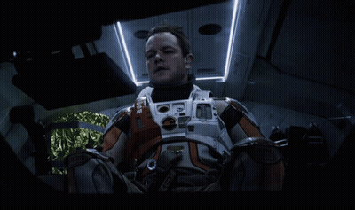 Man In Orange NASA Space Suit GIF