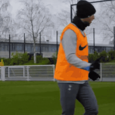 Man In Orange Nike Vest On Field GIF