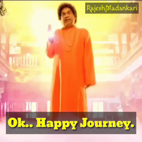 Man In Orange Robe With Ok Happy Journey Sign GIF