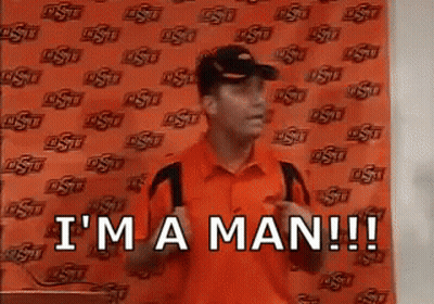 Man in Orange Shirt and Hat Saying I'm a Man