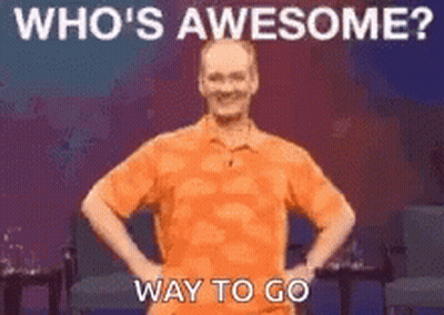 Man In Orange Shirt Hands On Hips Says Who's Awesome Way To Go GIF