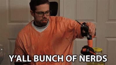 Man In Orange Shirt Holding Hose Says Y'all Bunch Of Nerds GIF
