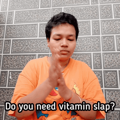 Man In Orange Shirt Saying Do You Need Vitamin Slap GIF