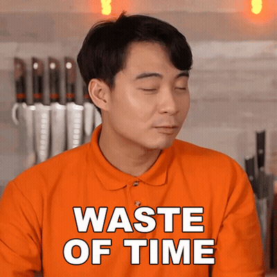 Man In Orange Shirt Saying Waste Of Time GIF
