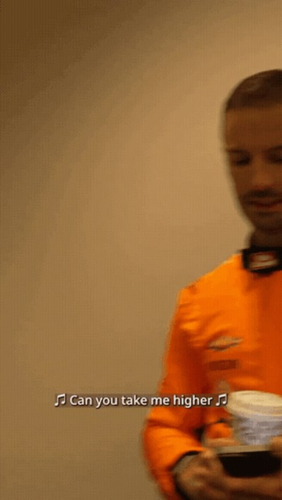 Man In Orange Shirt Singing Can You Take Me Higher GIF