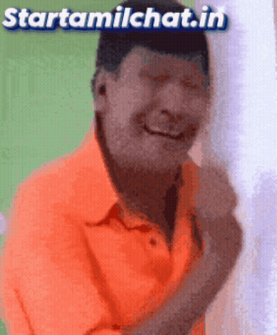 Man In Orange Shirt Smiling GIF