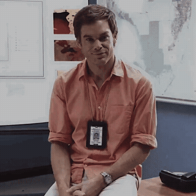 Man in Orange Shirt with Dexter Badge