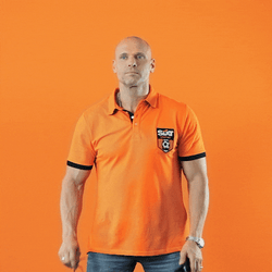 Man In Orange Shirt With Glasses And Calculator GIF