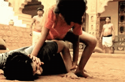 Man In Orange Shirt Wrestling GIF