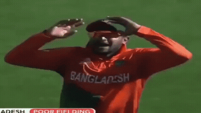Man In Orange Soccer Jersey Lying On Grass GIF