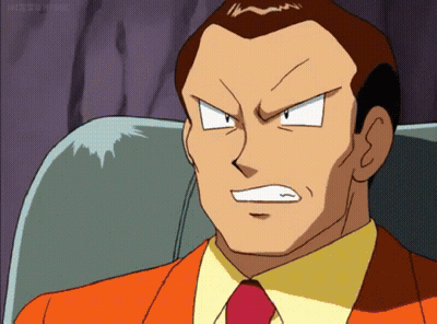 Man In Orange Suit And Red Tie Sitting Angry GIF