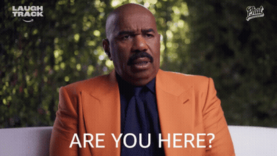 Man In Orange Suit Asking Are You Here GIF
