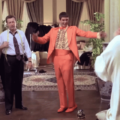 Man In Orange Suit Dancing GIF