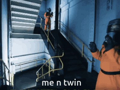 Man in Orange Suit Standing on Stairs