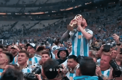 Man In Orange Suit With Longhorn In Crowd GIF