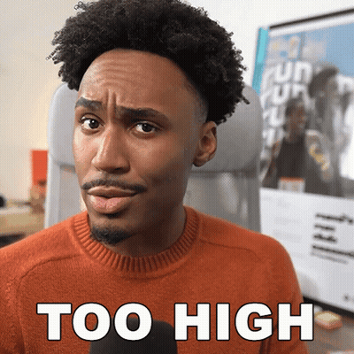 Man In Orange Sweater Making Funny Face Saying Too High GIF