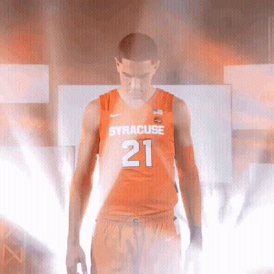 Man In Orange Syracuse Jersey In Dim Room GIF