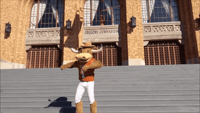 Man In Orange Texas Shirt Giving Peace Sign GIF