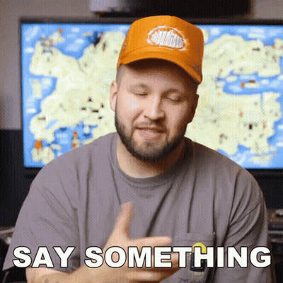 Man In Orange Trucker Hat Speaking GIF