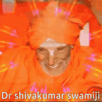 Man In Orange Turban Smiling Dr Shivakumar Swamji GIF