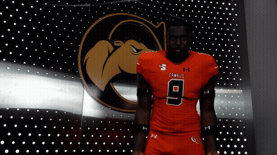 Man In Orange Under Armour Jersey Number 9 GIF