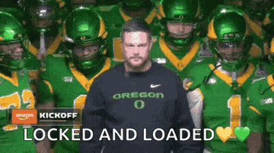 Man In Oregon Sweatshirt With Football Players GIF