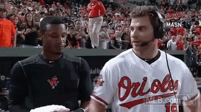 Man In Orioles Jersey Talking In Dugout GIF