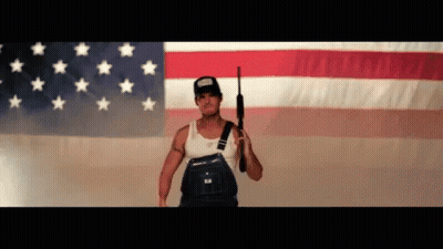 Man In Overalls Holding Gun GIF