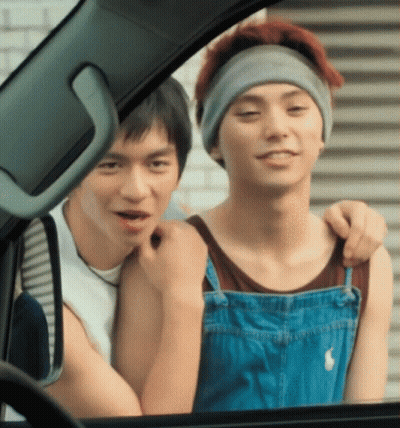 Man In Overalls Hugging Another Man GIF