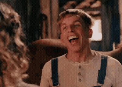 Man In Overalls Laughing With Woman GIF