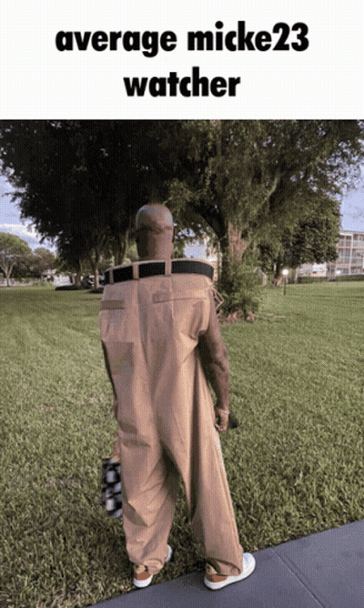 Man In Overalls Walking With Average Mick23 Watcher GIF