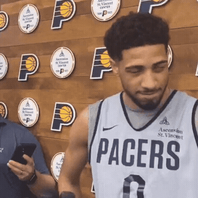 Man In Pacers Jersey Looking At Phone GIF