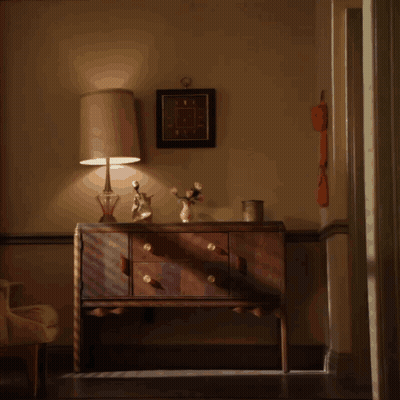 Man In Pajamas Standing In Front Of Dresser GIF