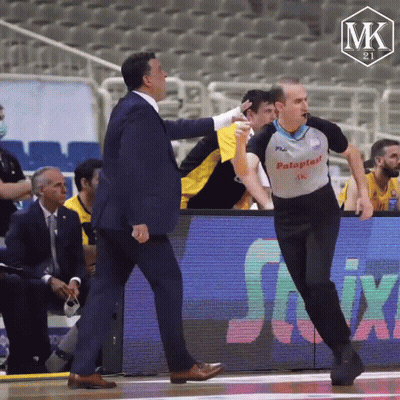 Man In Palaplast Shirt Talking To Another Man GIF