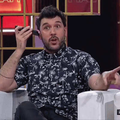 Man In Palm Tree Shirt Talking On Phone GIF