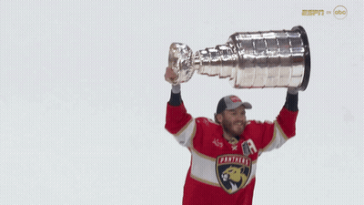 Man In Panthers Jersey Holding Trophy GIF