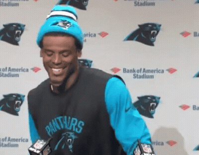 Man In Panthers Jersey Smiling At Bank Of America Stadium GIF