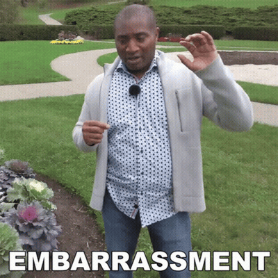 Man In Park With Embarrassment Text GIF