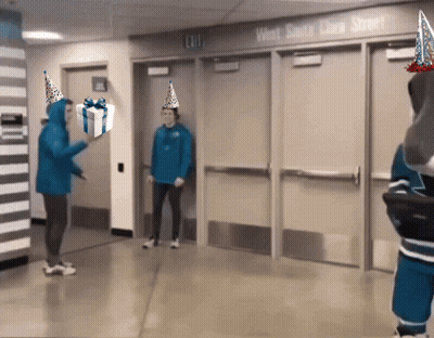 Man In Party Hat Holding Gift At Exit Door GIF