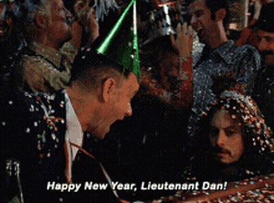 Man In Party Hat Says Happy New Year Lieutenant Dan GIF