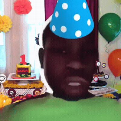 Man in Party Hat With Birthday Cake Number 1