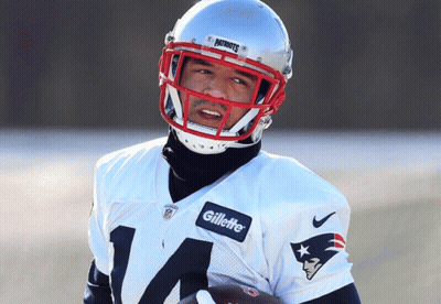 Man In Patriots Jersey And Gillette Helmet Holding Football GIF
