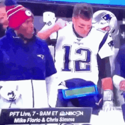 Man In Patriots Jersey Next To Man With Hat GIF