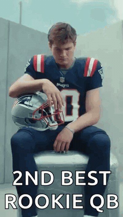 Man In Patriots Jersey Sitting On Cooler Holding Helmet GIF